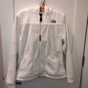 The North Face white fuzzy jacket.